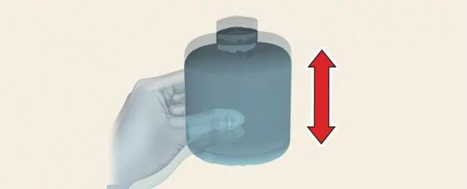 Kia EV6 shaking the Tire Mobility Kit sealant bottle before use